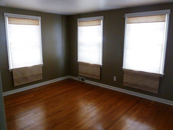 84 Mayflower Road Springfield, MA 01118 - Photo 10 of 14 a view of an empty room with wooden floor and a window