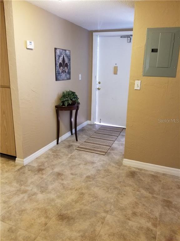 4600 98th Way North, Unit 202 St. Petersburg, FL 33708 - Photo 1 of 1 a view of a livingroom with wooden floor