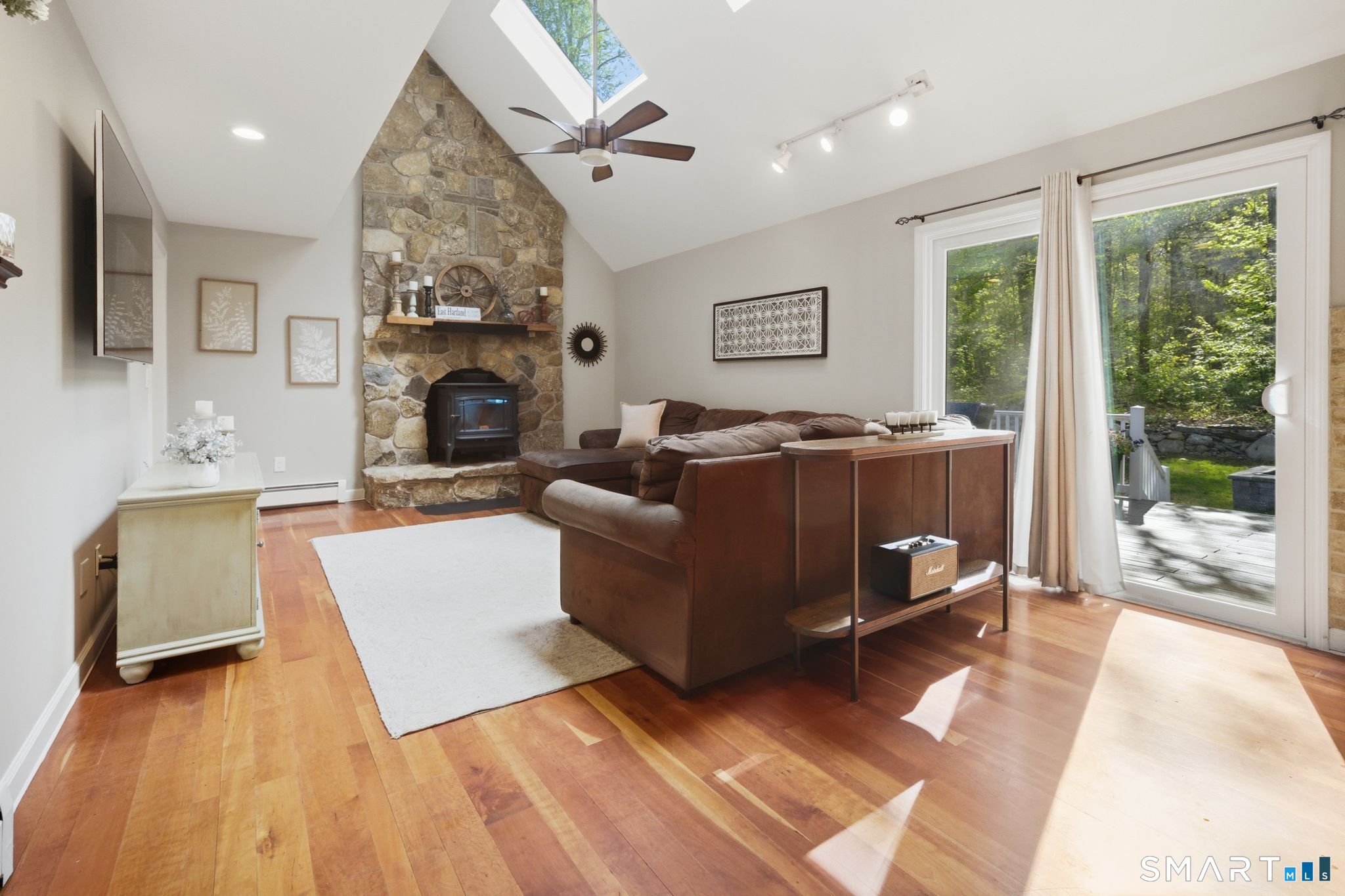 174 Walnut Hill Road Hartland, CT 06027 - Photo 15 of 36 a living room with furniture and a fireplace