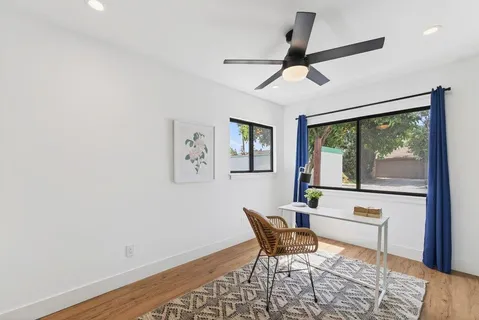 a view of a livingroom with furniture and wooden floor