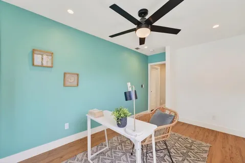 a view of dining room with a table and chairs