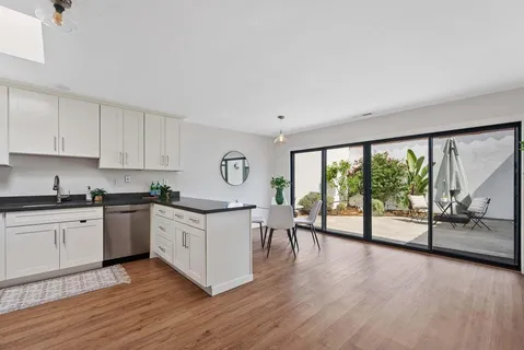 a kitchen with stainless steel appliances a stove top oven