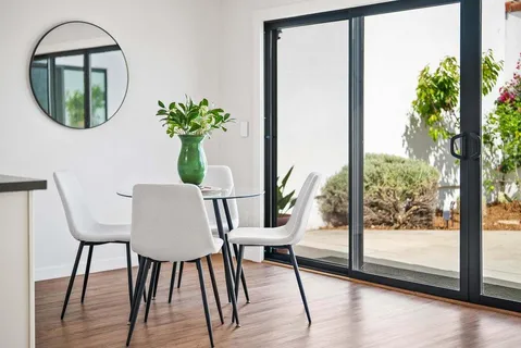 a backyard of a house with outdoor seating