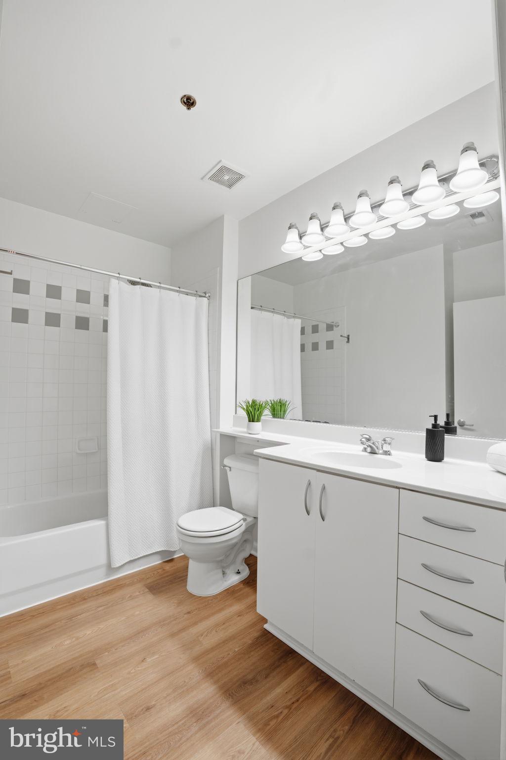 1300 N Street Northwest, Unit 207 Washington, DC 20005 - Photo 16 of 24 a bathroom with a sink and a mirror