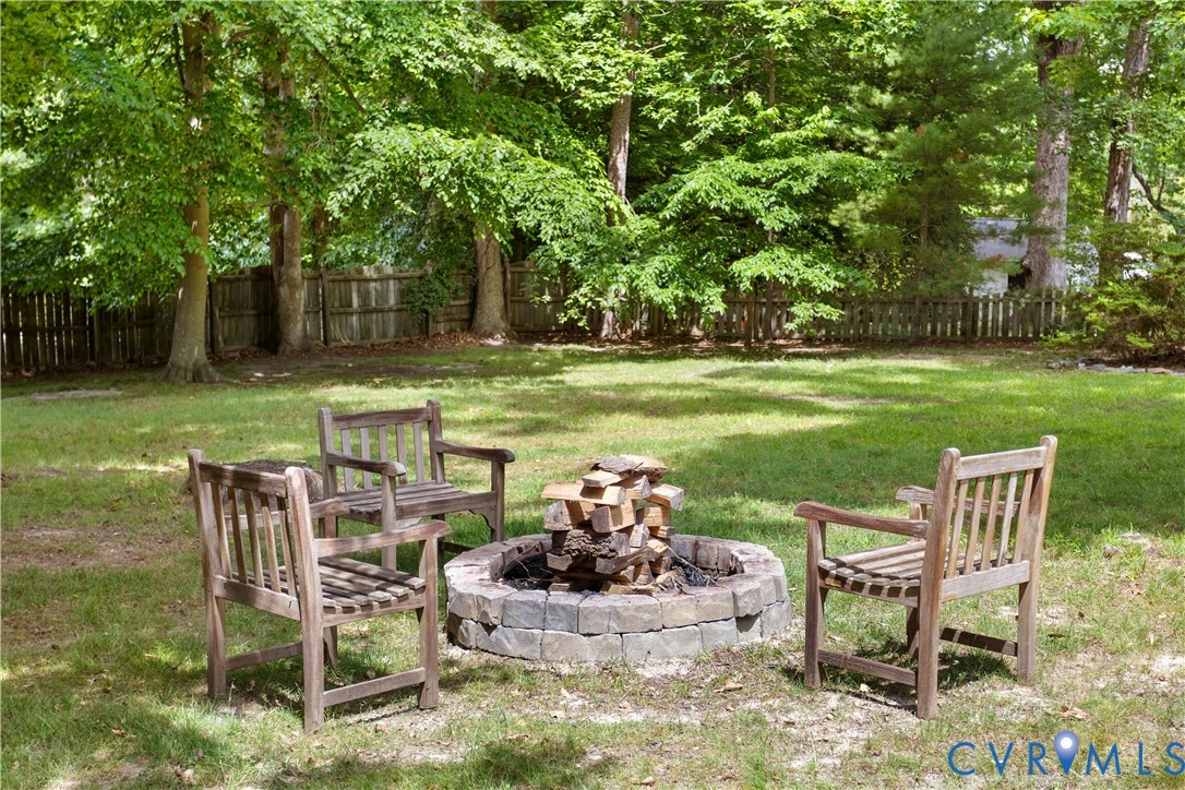 3136 Old Quarry Road Richmond, VA 23225 - Photo 22 of 39 Expansive yard space featuring a circular stone fi
