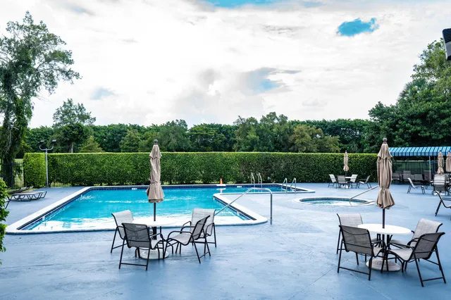 a view of a chairs and tables in the patio