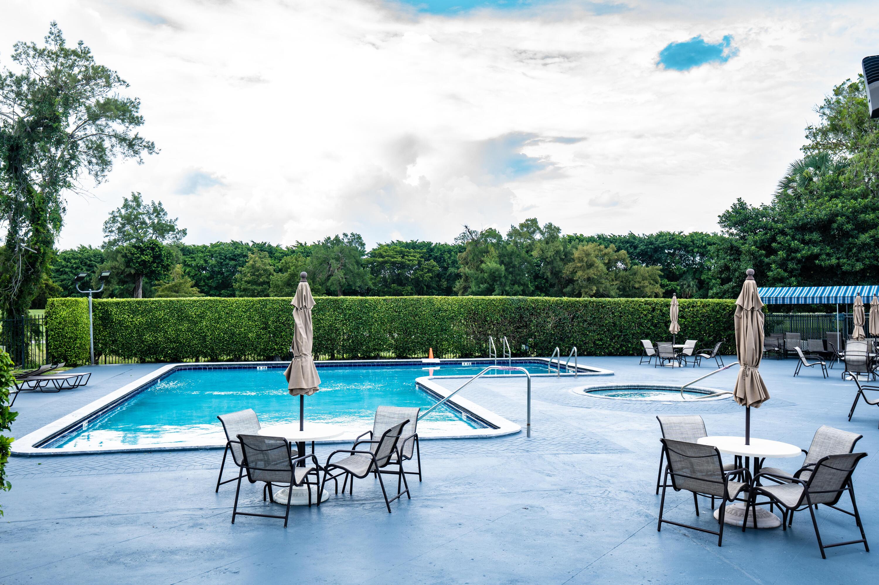 8360 Sands Point Boulevard, Unit G306 Tamarac, FL 33321 - Photo 13 of 13 a view of a chairs and tables in the patio