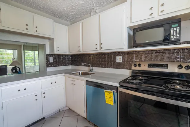 a kitchen with a stove and a microwave
