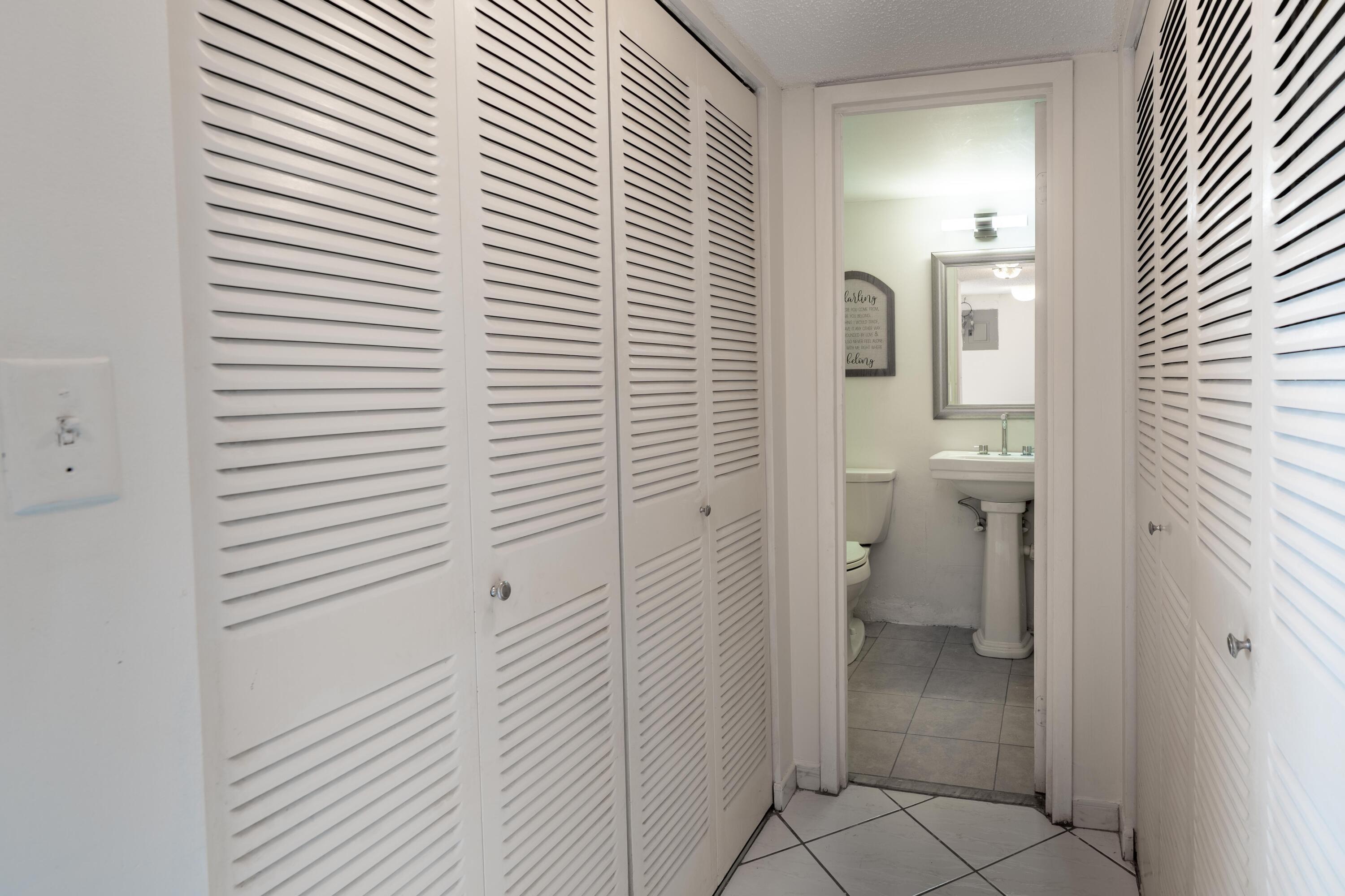 8360 Sands Point Boulevard, Unit G306 Tamarac, FL 33321 - Photo 5 of 13 view of a bathroom with a toilet