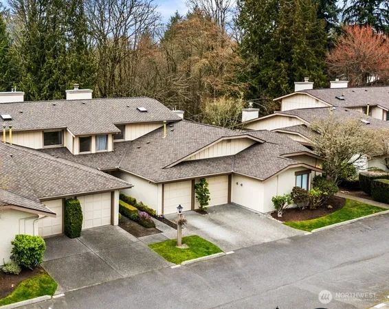 a aerial view of a house with swimming pool and sitting area