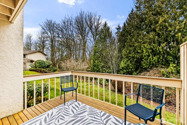 a view of a two chairs in the balcony
