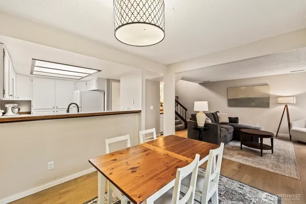a very nice looking dining room with a table and chairs