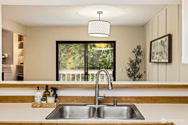 a kitchen with a sink and a window