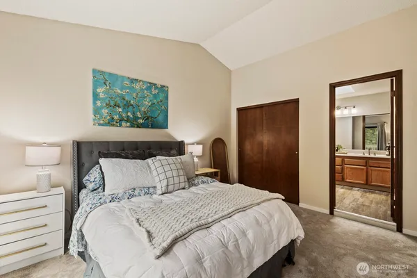 a bedroom with a bed and a view of bathroom