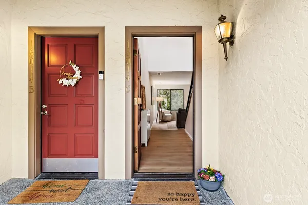 a view of a hallway and a livingroom and a chandelier