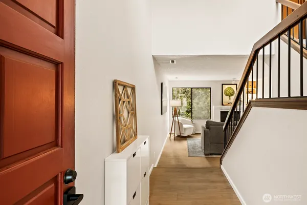 a living room with furniture and a stairs