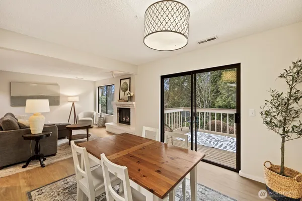 a living room with furniture a rug and a large window