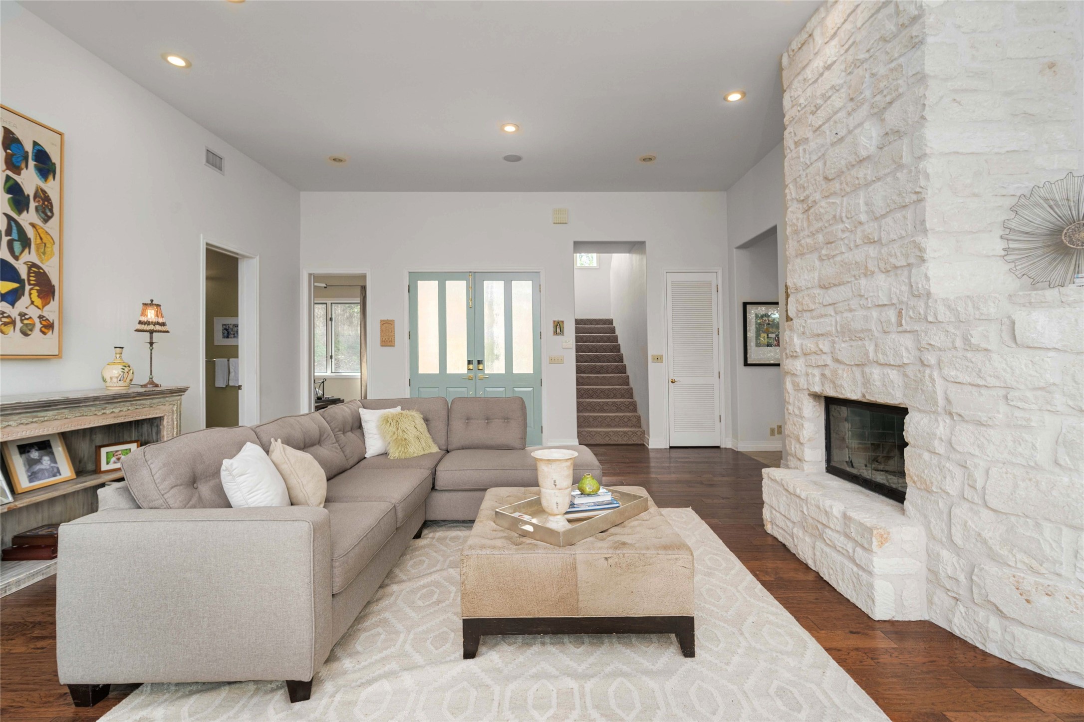 2102 Paisano Road Austin, TX 78746 - Photo 5 of 26 Living area with a stone fireplace, recessed lighting, and dark wood-type flooring