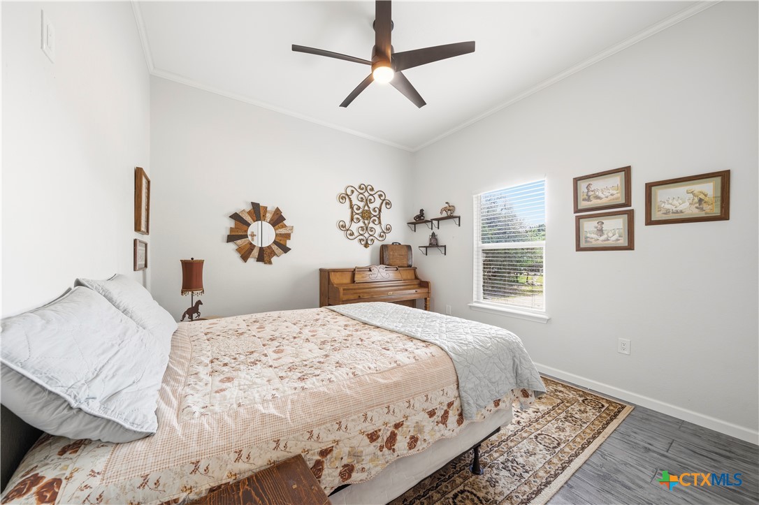 351 Line Camp Loop Spring Branch, TX 78070 - Photo 14 of 27 a bedroom with a large bed and a window