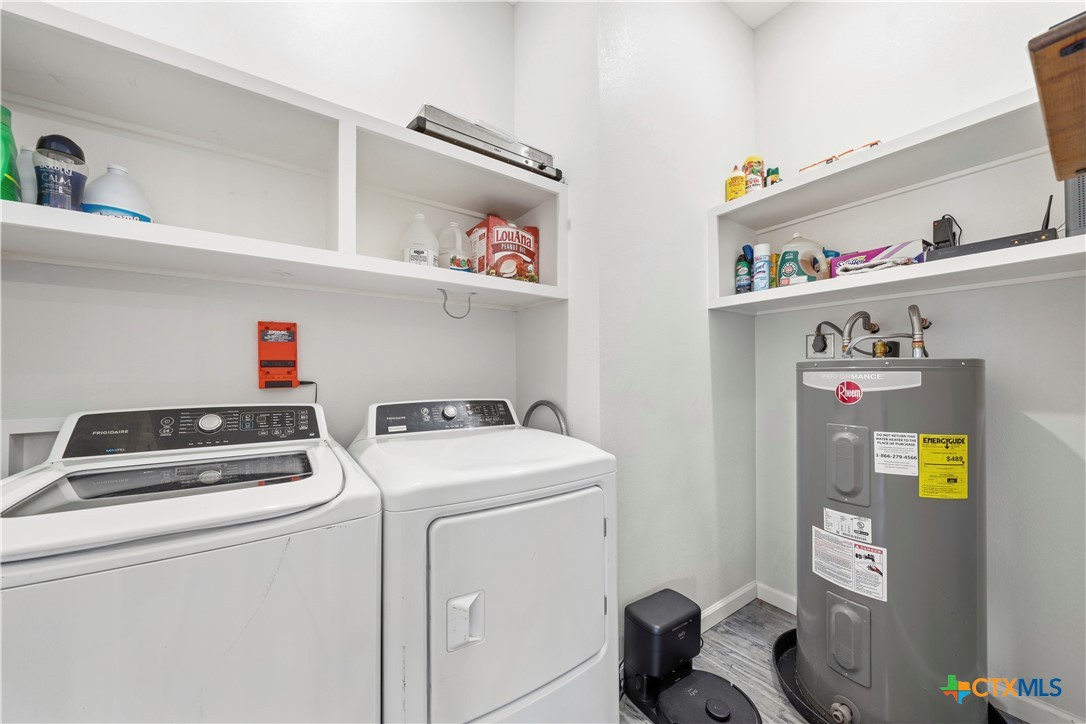 351 Line Camp Loop Spring Branch, TX 78070 - Photo 16 of 27 a utility room with dryer and washer