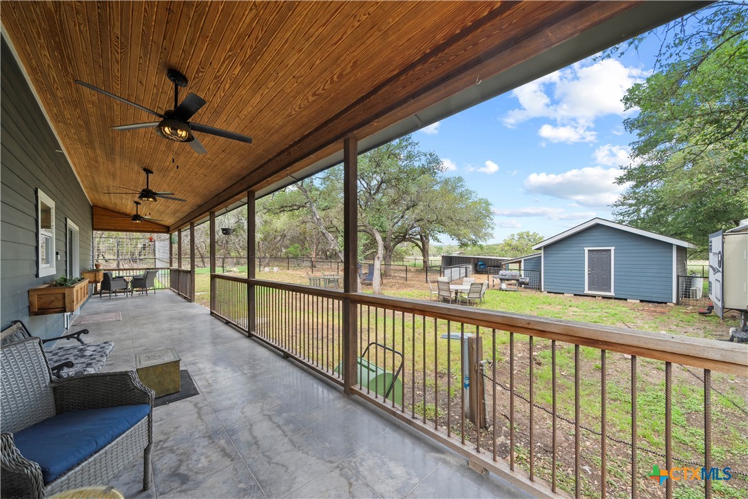 351 Line Camp Loop Spring Branch, TX 78070 - Photo 18 of 27 a view of a porch with furniture and a backyard
