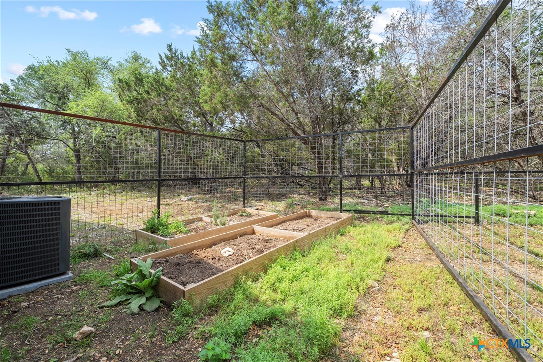 351 Line Camp Loop Spring Branch, TX 78070 - Photo 20 of 27 a view of a backyard with a wooden fence