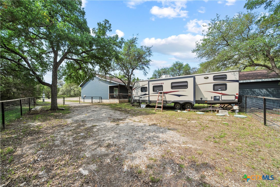 351 Line Camp Loop Spring Branch, TX 78070 - Photo 24 of 27 a view of a house with backyard and trees