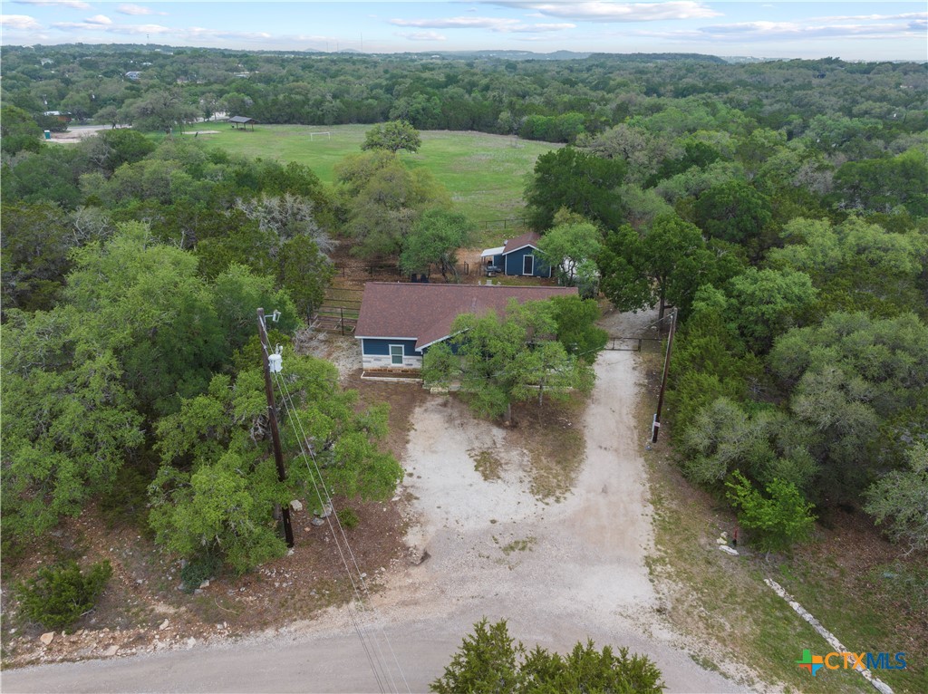 351 Line Camp Loop Spring Branch, TX 78070 - Photo 25 of 27 an aerial view of a house with a yard