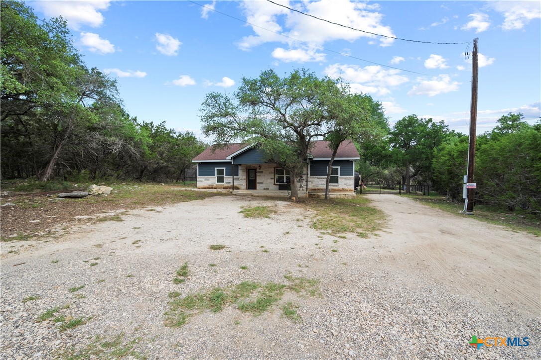 351 Line Camp Loop Spring Branch, TX 78070 - Photo 27 of 27 a house with swimming pool in front of it