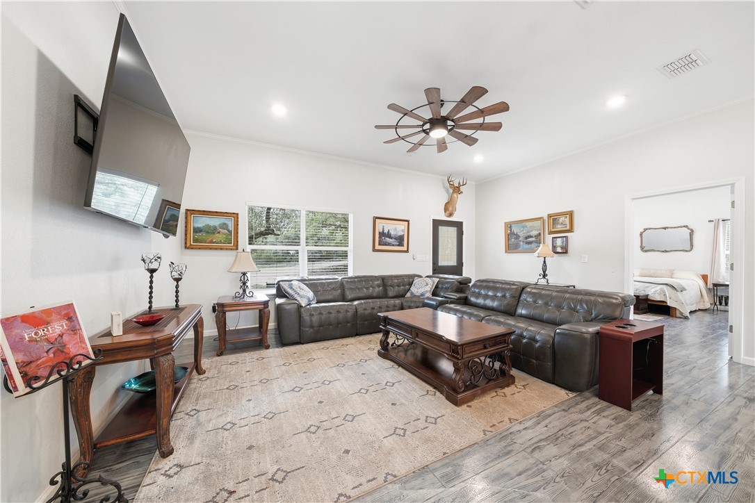 351 Line Camp Loop Spring Branch, TX 78070 - Photo 3 of 27 a living room with furniture and a flat screen tv