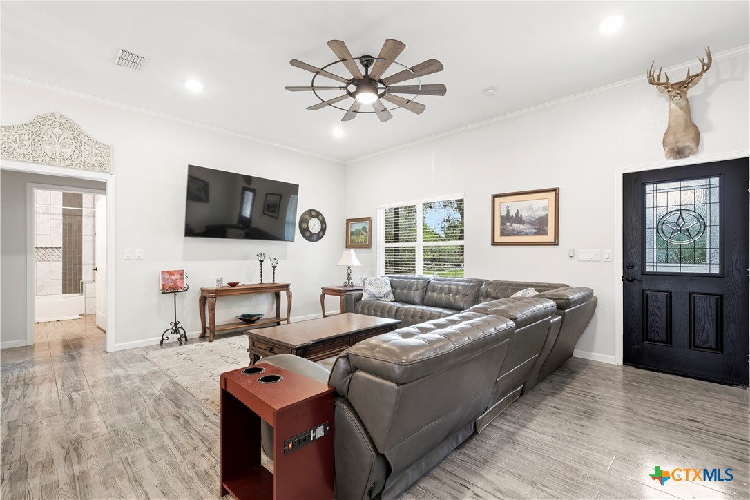 351 Line Camp Loop Spring Branch, TX 78070 - Photo 4 of 27 a living room with furniture and a flat screen tv