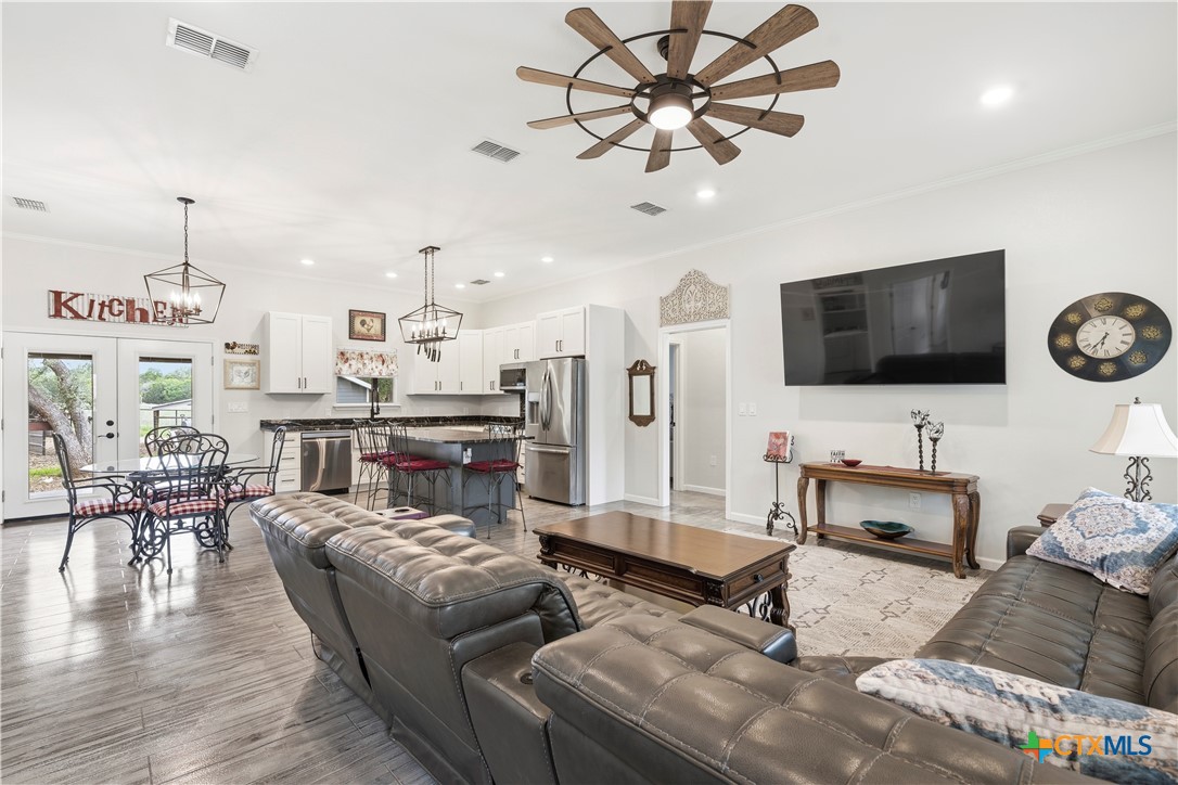 351 Line Camp Loop Spring Branch, TX 78070 - Photo 5 of 27 a living room with furniture and a flat screen tv