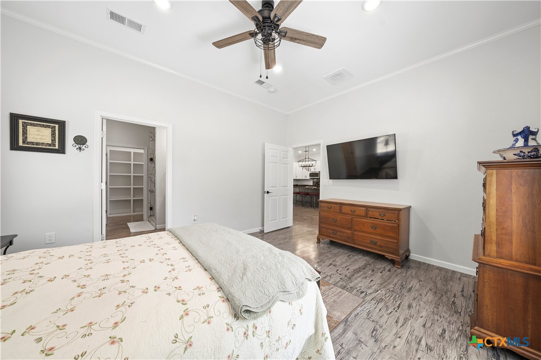 351 Line Camp Loop Spring Branch, TX 78070 - Photo 10 of 27 a bedroom with a bed and a flat screen tv