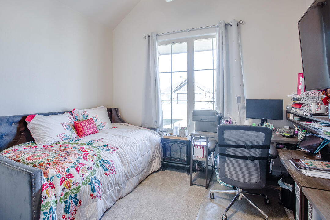 5701 119th Street Lubbock, TX 79424 - Photo 15 of 22 a bedroom with a bed and a window