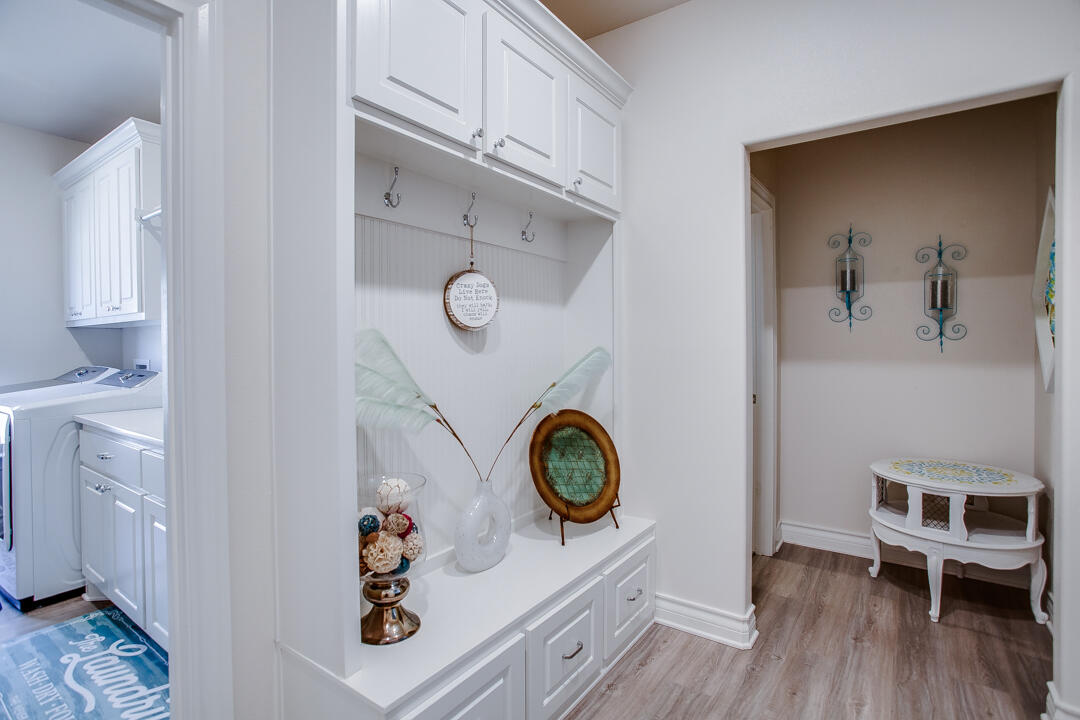5701 119th Street Lubbock, TX 79424 - Photo 20 of 22 a view of a hallway with entryway and wooden floor