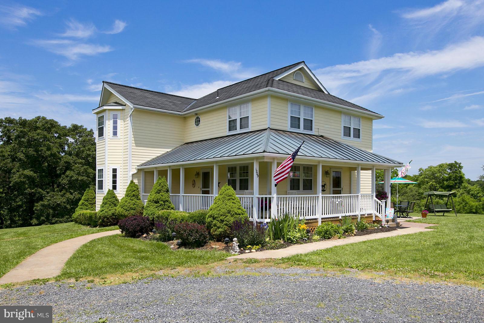 1209 Hollow Road Gore, VA 22637 - Photo 2 of 30 a front view of a house with a yard