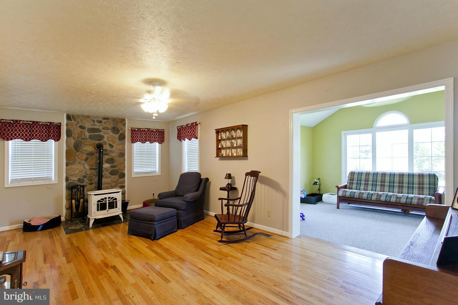1209 Hollow Road Gore, VA 22637 - Photo 11 of 30 a living room with furniture window and a flat screen tv