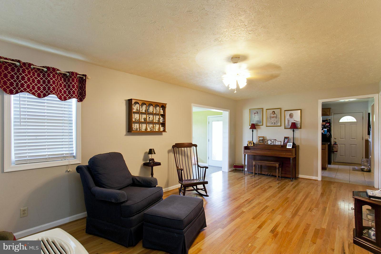 1209 Hollow Road Gore, VA 22637 - Photo 13 of 30 a living room with furniture and a wooden floor