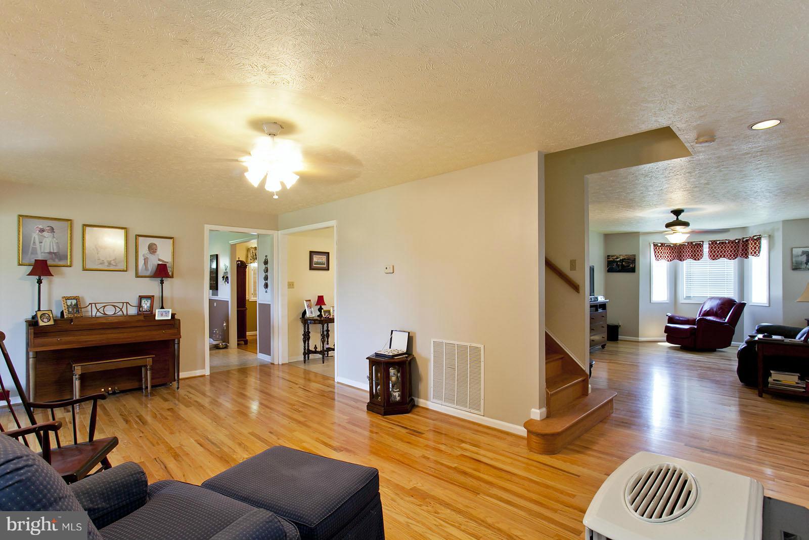 1209 Hollow Road Gore, VA 22637 - Photo 14 of 30 a living room with furniture and wooden floor