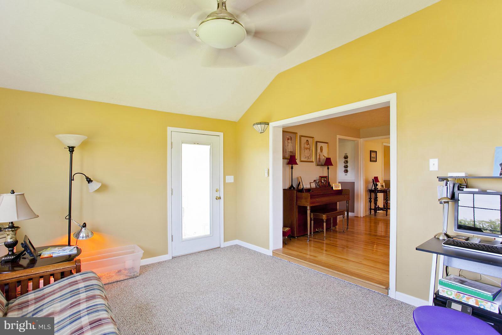 1209 Hollow Road Gore, VA 22637 - Photo 16 of 30 a bedroom with furniture and a chandelier