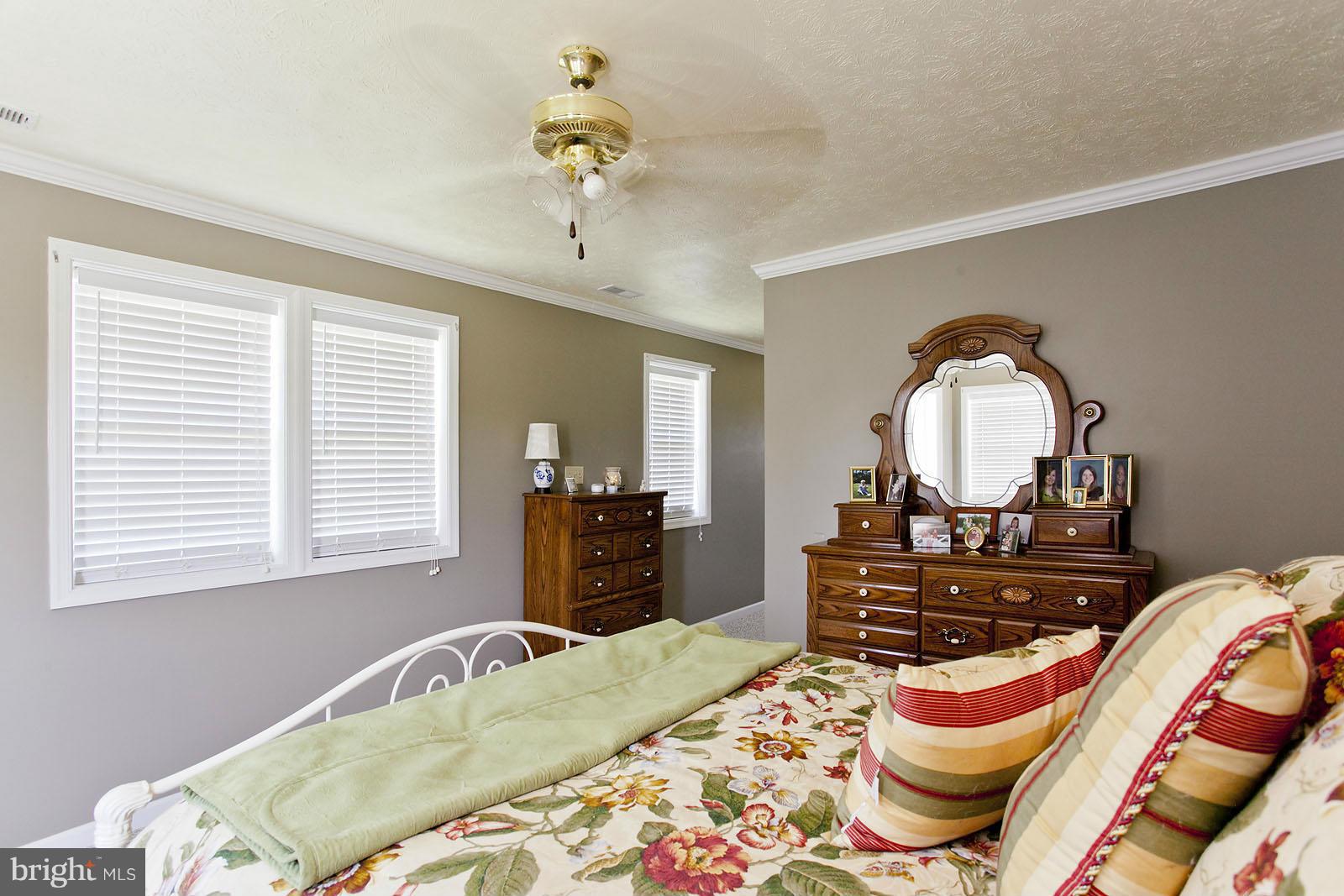 1209 Hollow Road Gore, VA 22637 - Photo 19 of 30 a bedroom with a bed and dresser