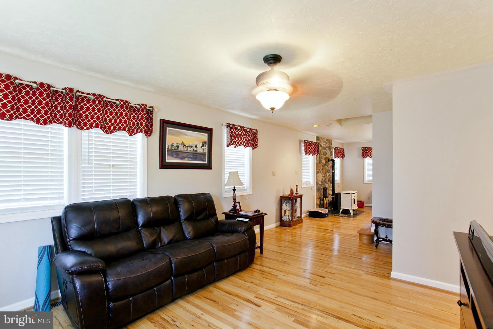 1209 Hollow Road Gore, VA 22637 - Photo 3 of 30 a living room with furniture wooden floor and a large window