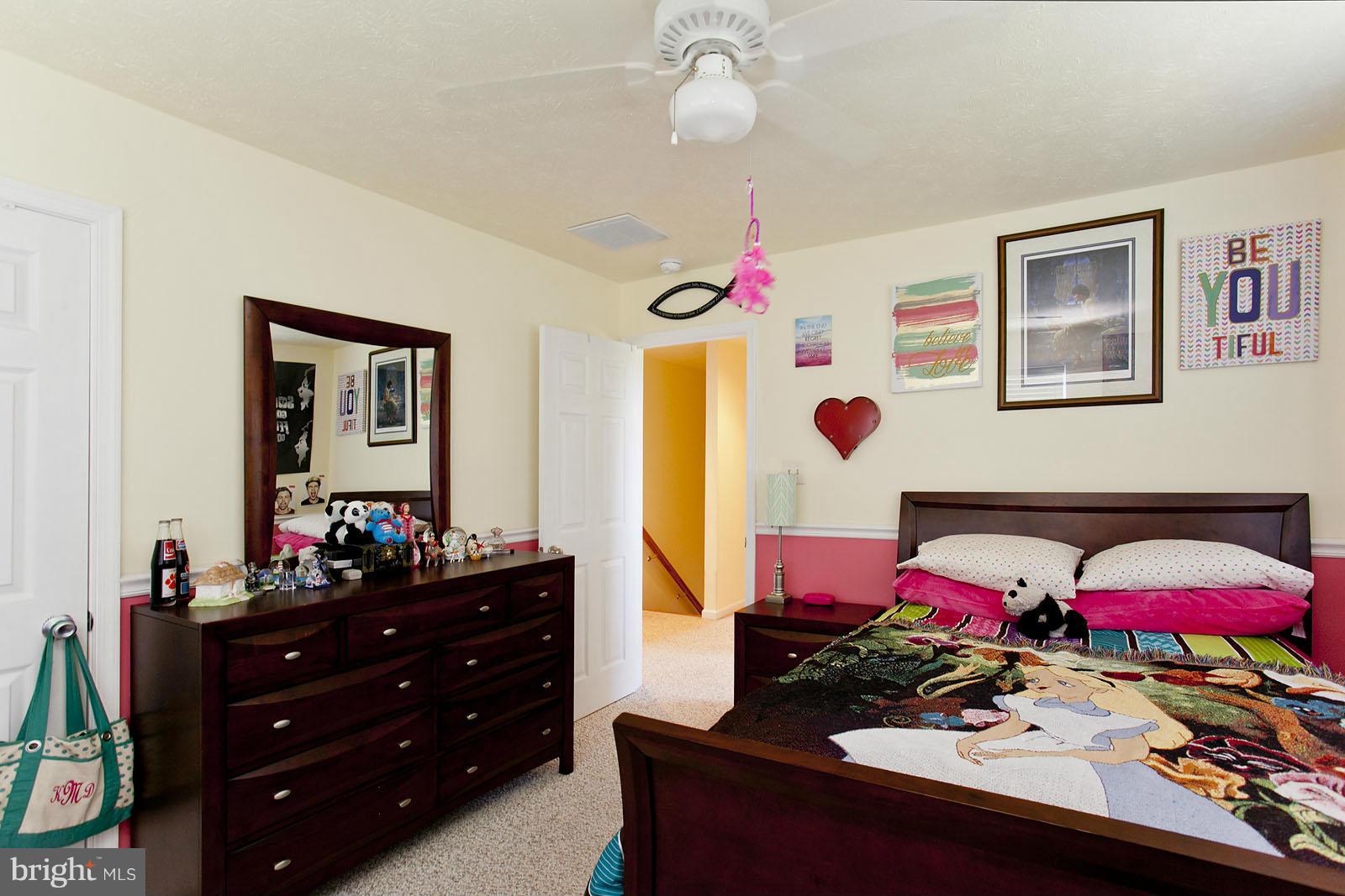 1209 Hollow Road Gore, VA 22637 - Photo 23 of 30 a bedroom with furniture and a dresser