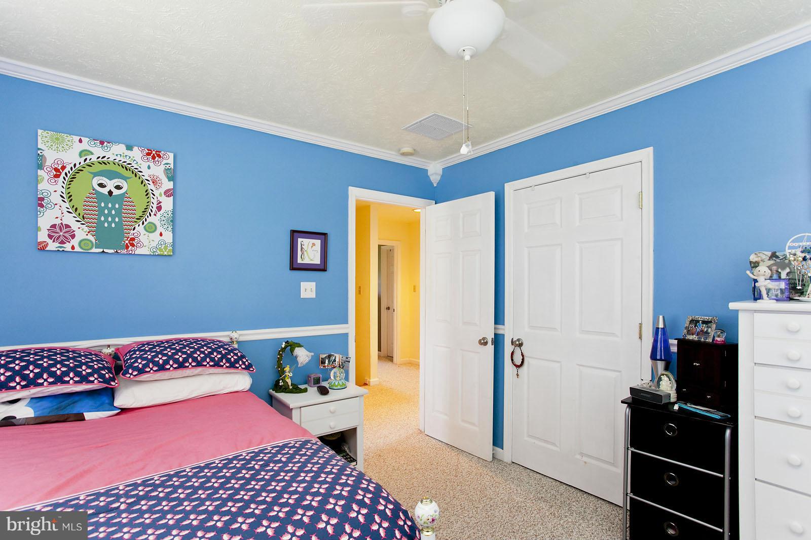 1209 Hollow Road Gore, VA 22637 - Photo 25 of 30 a bedroom with a bed and wooden floor