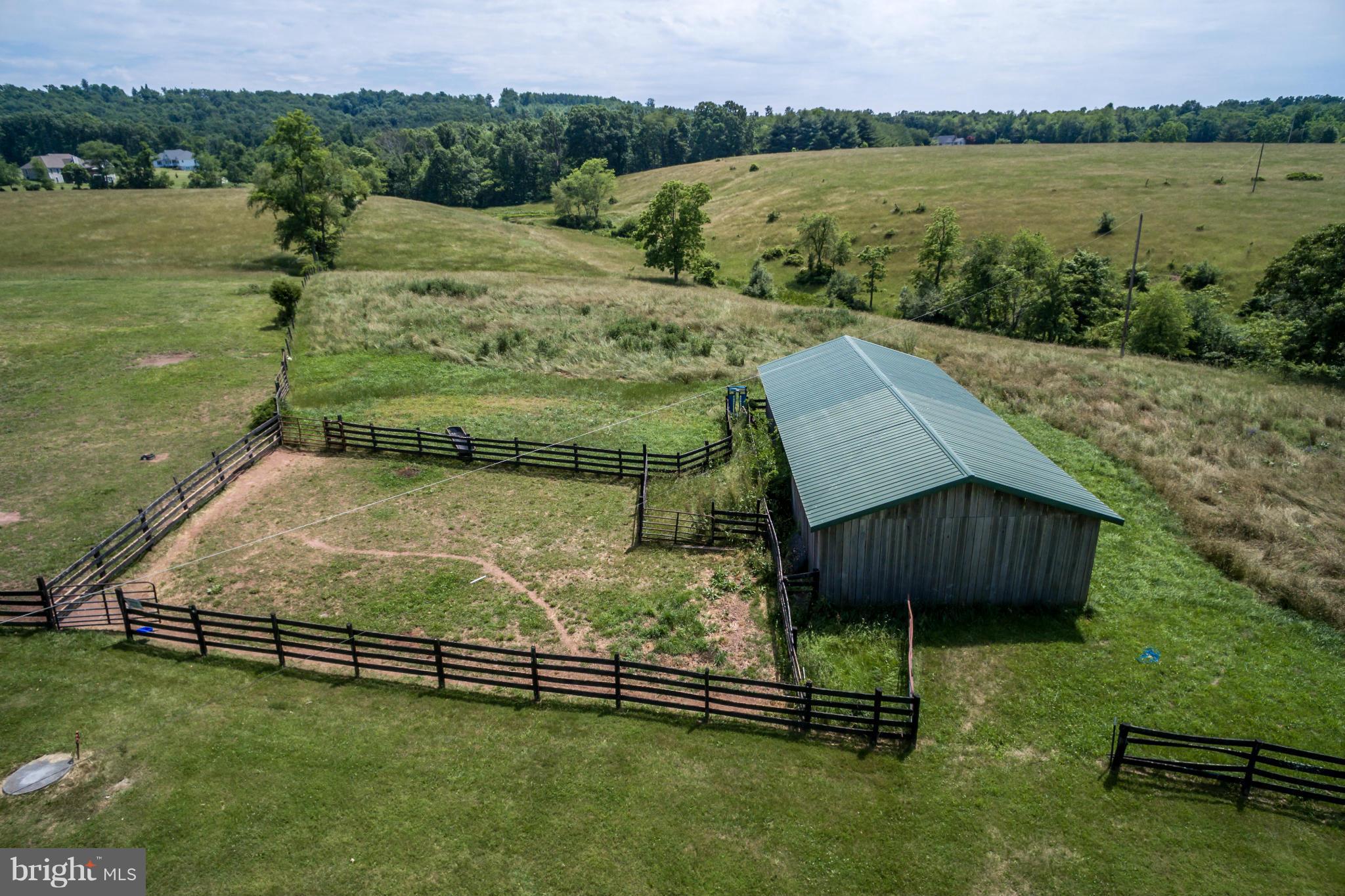 1209 Hollow Road Gore, VA 22637 - Photo 29 of 30 a view of a garden with a bench in the background