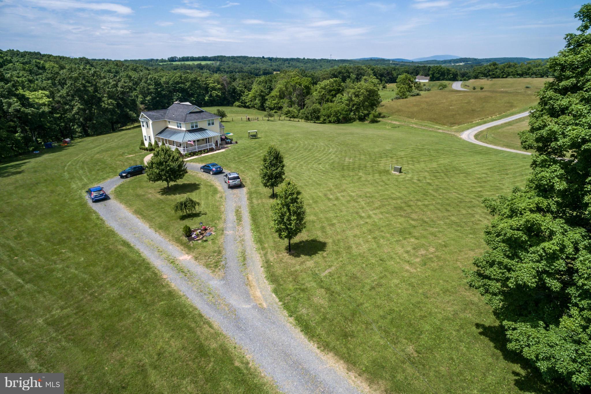 1209 Hollow Road Gore, VA 22637 - Photo 30 of 30 a aerial view of a house with a garden and lake view