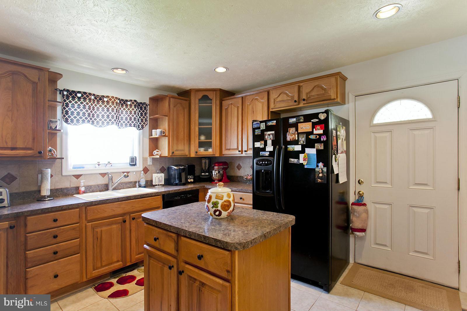 1209 Hollow Road Gore, VA 22637 - Photo 7 of 30 a kitchen with a sink stove and refrigerator