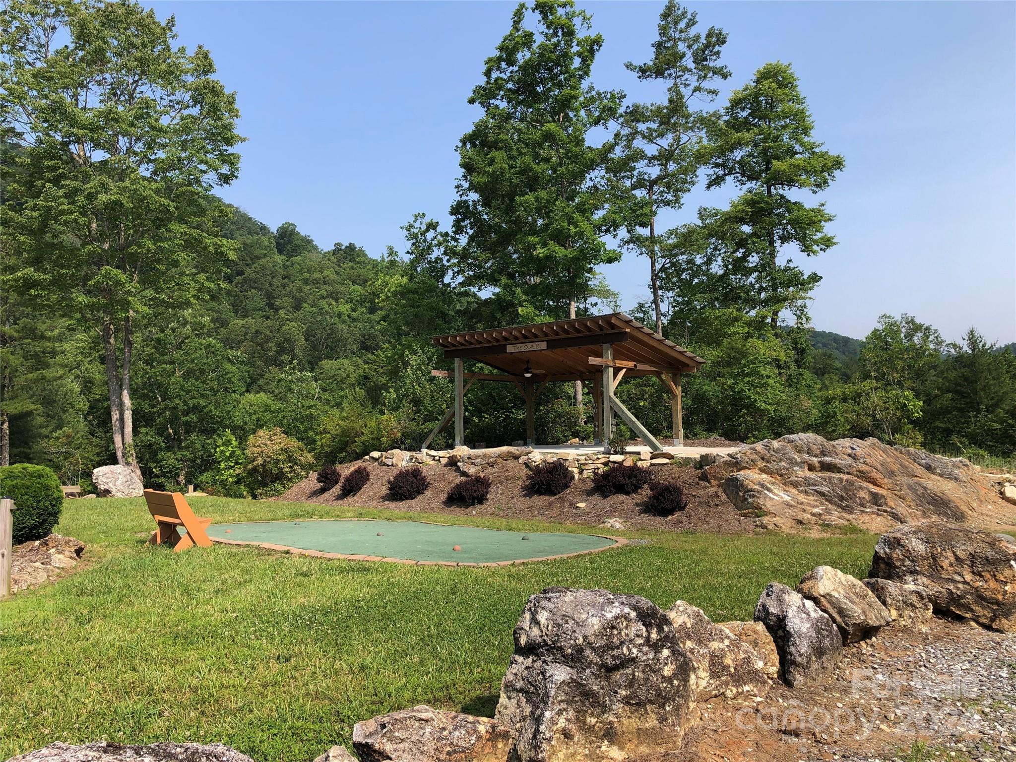 Tbd Wolf Pen Road, Unit 24 Purlear, NC 28665 - Photo 45 of 46 a view of a backyard with a garden and plants