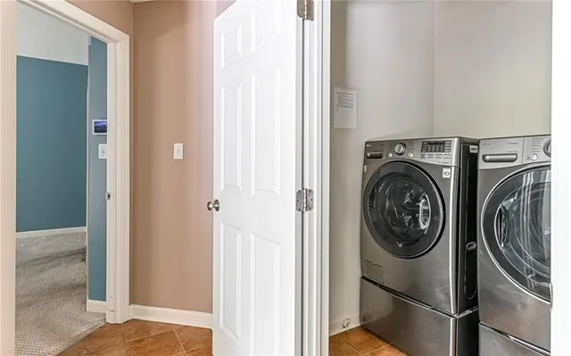 an empty room with a window and a ceiling fan
