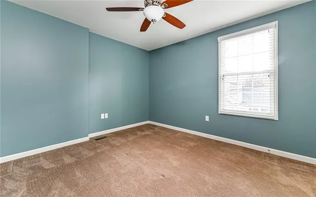 a view of a house with backyard and garden